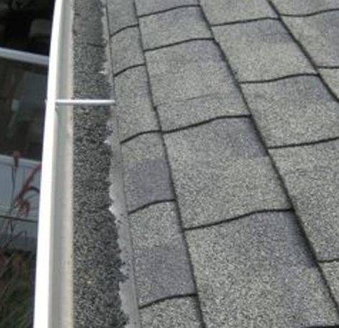 damaged gutter roof repair and repalcement with dirt in gutters