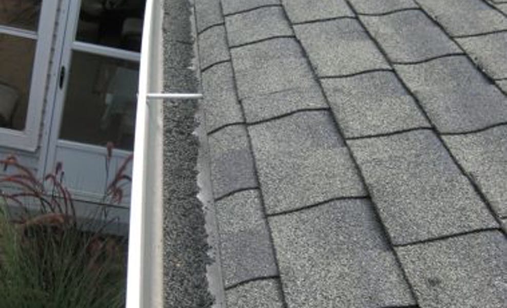 damaged gutter roof repair and repalcement with dirt in gutters