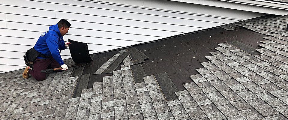 RoofPRO contractor replacing shingles on roof