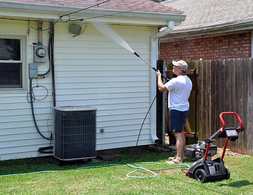 maryland homeowner cleaning siding