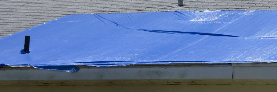emergency tarp on roof during replacement